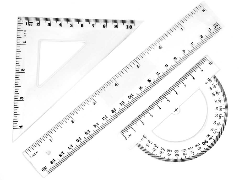 Close Up Of Different Rulers And School Supplies On White Background With Clipping Path